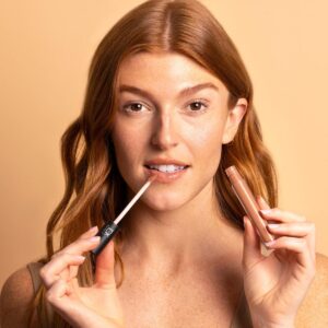 Shop TOK Beauty Lip Tonic in shade Glow, a warm sheer golden gloss with shimmer.