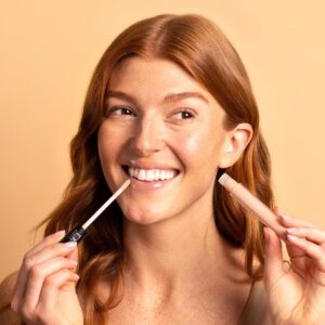 Tok Beauty Lip Tonic in shade Kind is a moisturizing lip gloss with a beach sand beige hue.