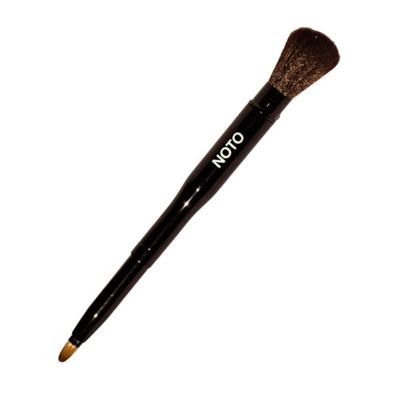 Shop NOTO Botanics Lip + Cheek Duo Brush, a retractable vegan duo brush for blending, contour and precision makeup application.