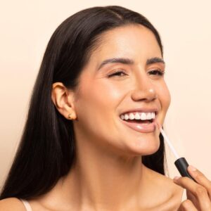 Shop TOK Beauty Lip Tonic in shade Love, a nude pink lip gloss.