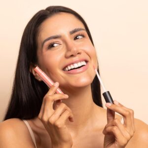 TOK Beauty Lip Tonic in shade Bloom, a moisturizing, non-sticky lip gloss with a peachy coral hue.