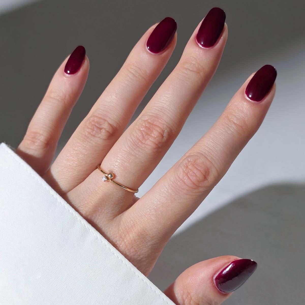Nailberry L'Oxygéné Nail Lacquer (Kirsch Kiss) Nailberry L'Oxygéné Nail Polish Kirsch Kiss is a bold and sultry burgundy that bursts with sweet depth.
