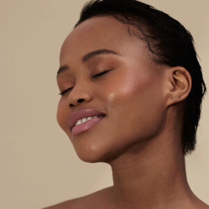 Henne Organics Lip Tint Sunlit, a builable peach hue for lips.