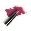 Henne Muse Tinted Lip Balm, a buildable berry mauve hue.