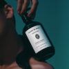 Sangre de Fruta Neroli Noir Botanical Shampoo, a handcrafted shampoo with a euphoric neroli scent.