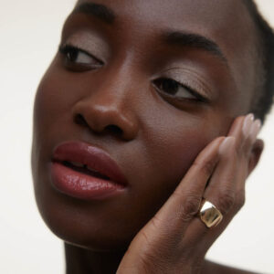 Wonderblush Le Baume Tinted Lip Balm Aurore is a buildable cherry blossom pink hue lip color.