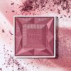 RMS Beauty ReDimension Hydra Powder Blush shade Hanky Panky is a playfully iridescent magenta plum.