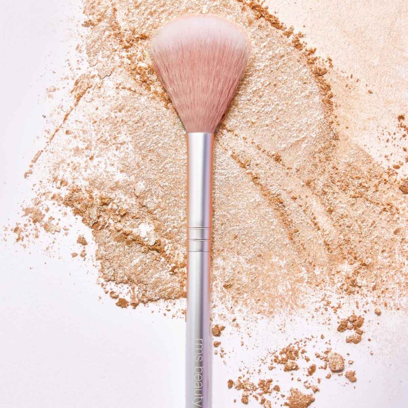 RMS Skin2Skin Classic Fan Brush is the perfect makeup brush for seamlessly applying powder highlighter and sheer color.