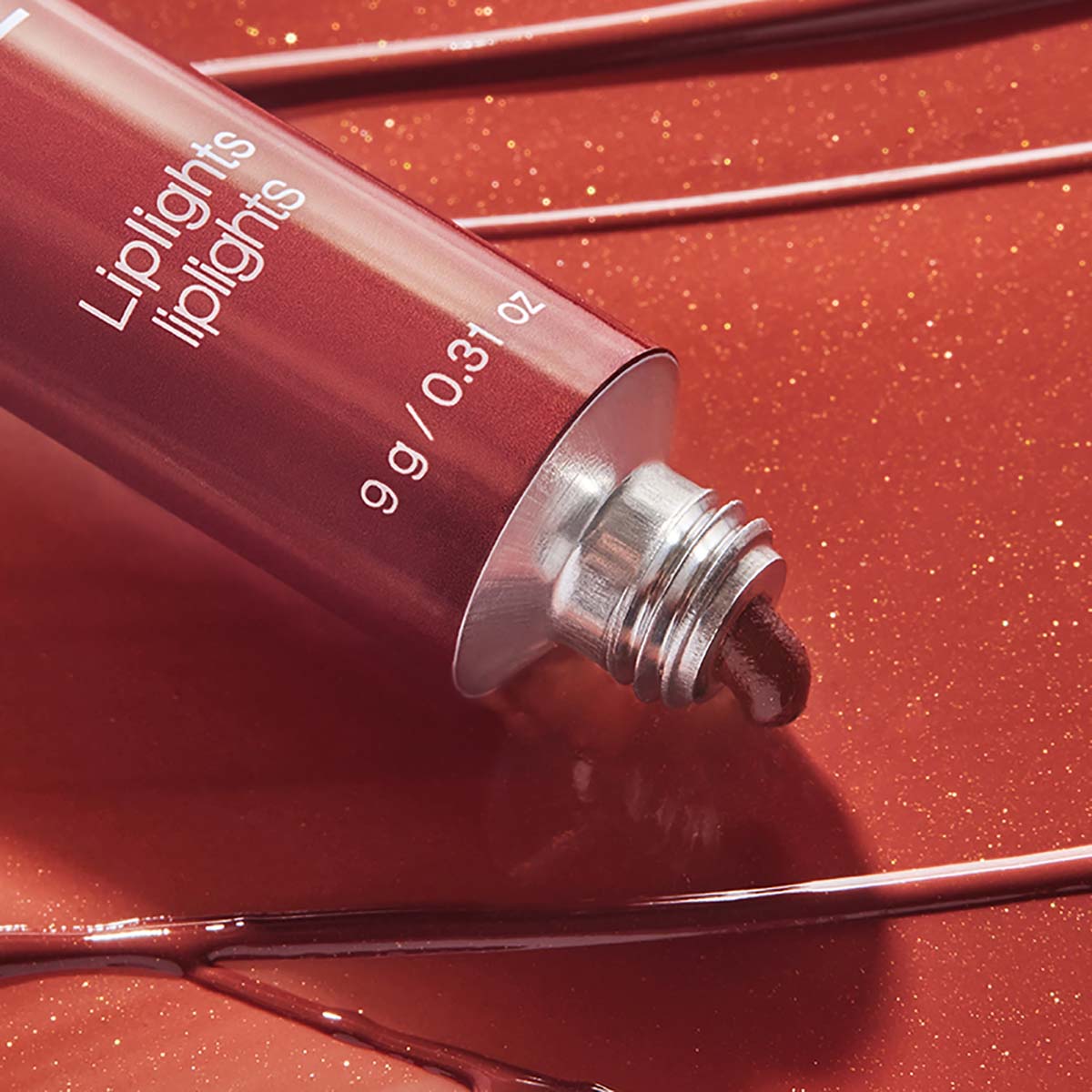 RMS Liplights Cream Lip Gloss Rhapsody is a spicy cinnamon hue.