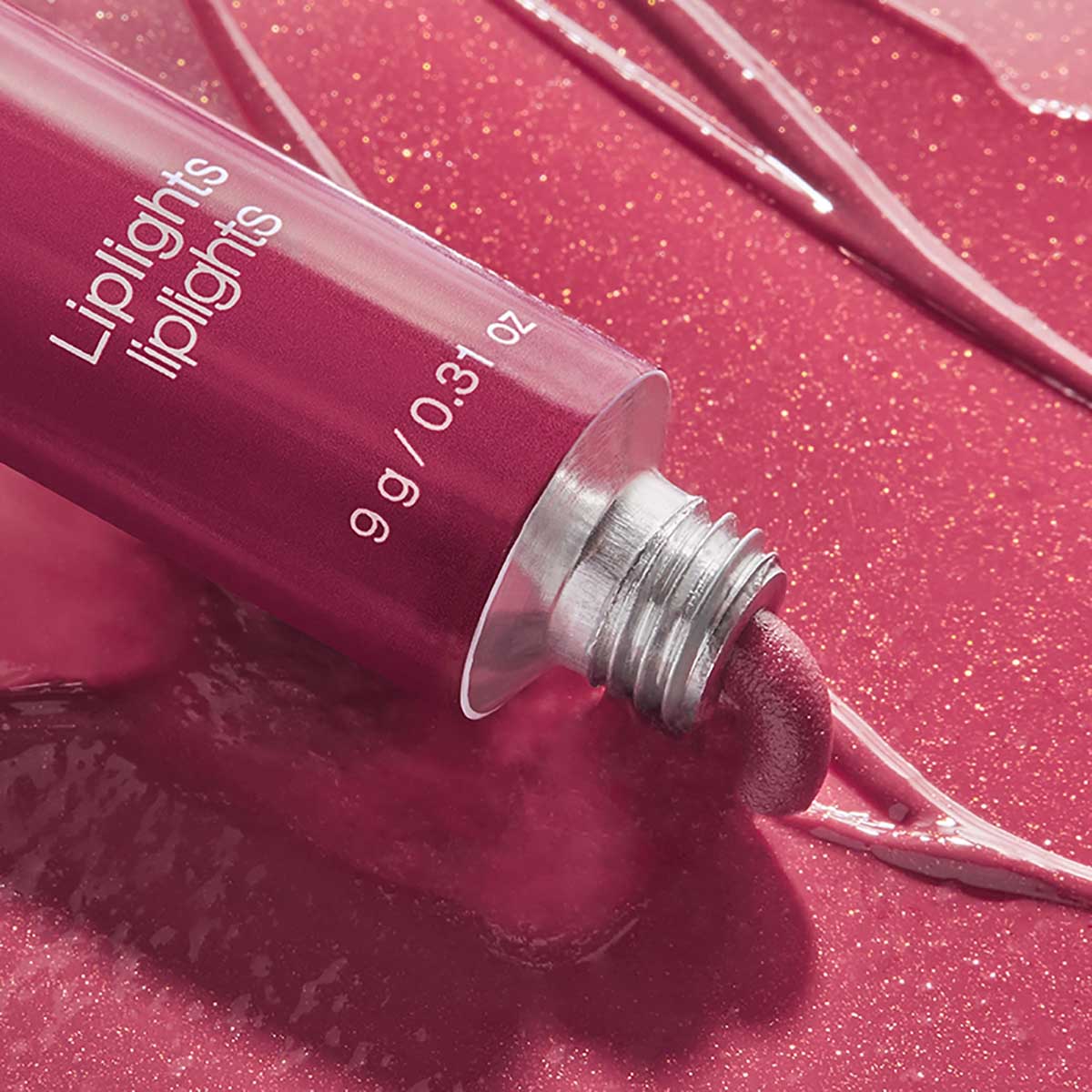 RMS Liplights Cream Lip Gloss Rhythm is a kissable cranberry hue.