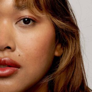 F. Miller Tinted Balm Tomato can be built up in multiple layers for a bright tomato or blend lightly for a natural peachy flush.