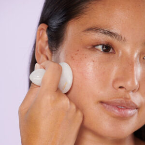 Wildling Lumin Mushroom, a white jade facial massage tool.