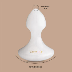 Wildling Lumin Mushroom is a white jade facial massage tool to calm and depuff the skin.