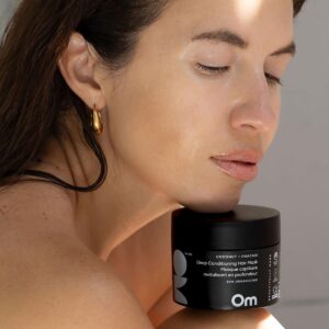 Use Om Organics Coconut + Pracaxi Deep Conditioning Hair Mask to nourish and restore dry and damaged hair.