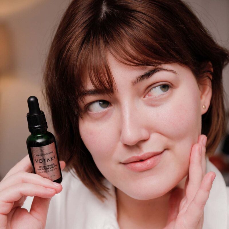 Skin looks nourished, glowing and naturally sun-kissed with VOTARY Hyaluronic Self-Tan Drops.