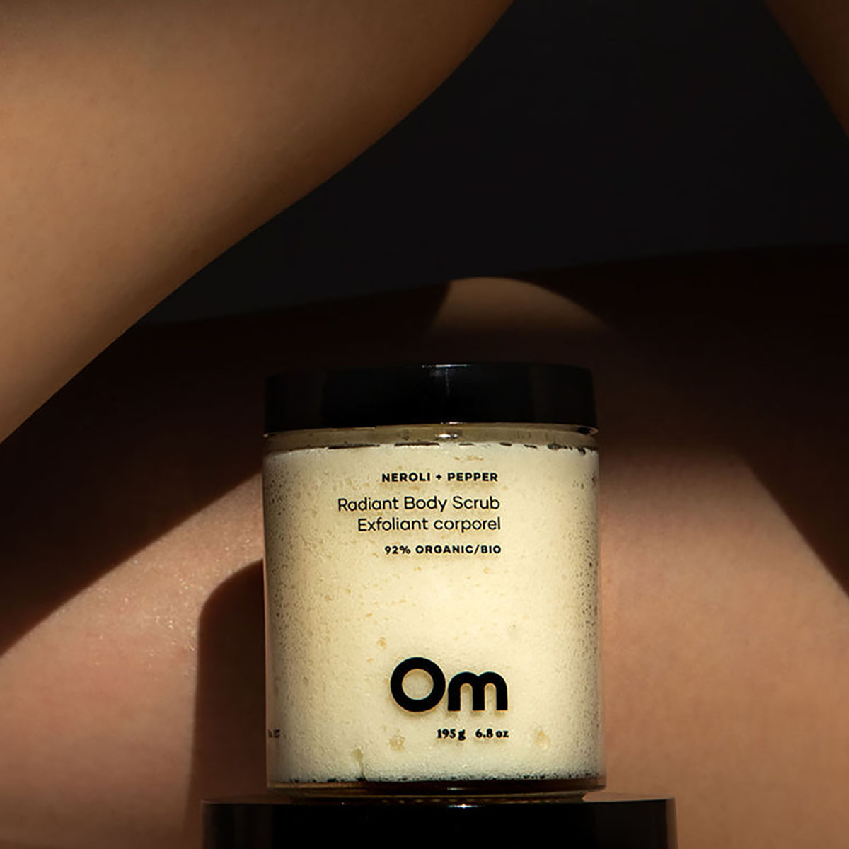 Om Organics Neroli + Pepper Radiant Body Scrub for smooth, radiant skin.