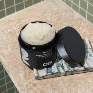 Om Organics Vanilla Moon Radiant Body Scrub exfoliates as it moisturizes, leaving skin silky smooth.