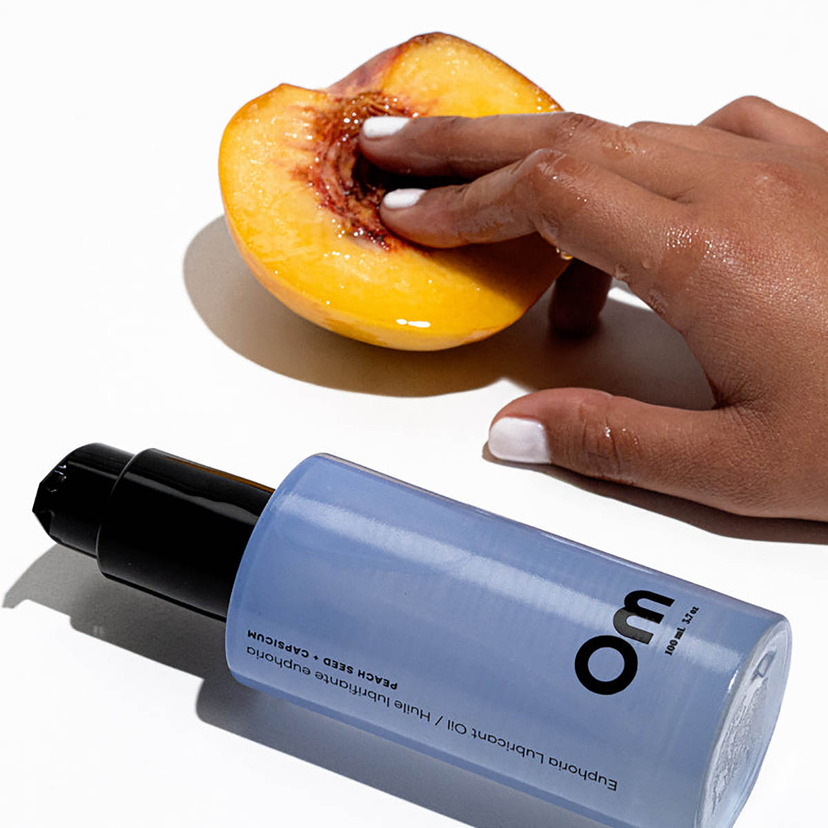 Om Organics Peach Seed + Capsicum Euphoria Lubricant Oil available at Inspire Beauty.