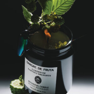 Sangre De Fruta Garden Of Earthly Delights Botanical Candle is a hand-poured soy wax candle with an ethereal herbaceous scent.