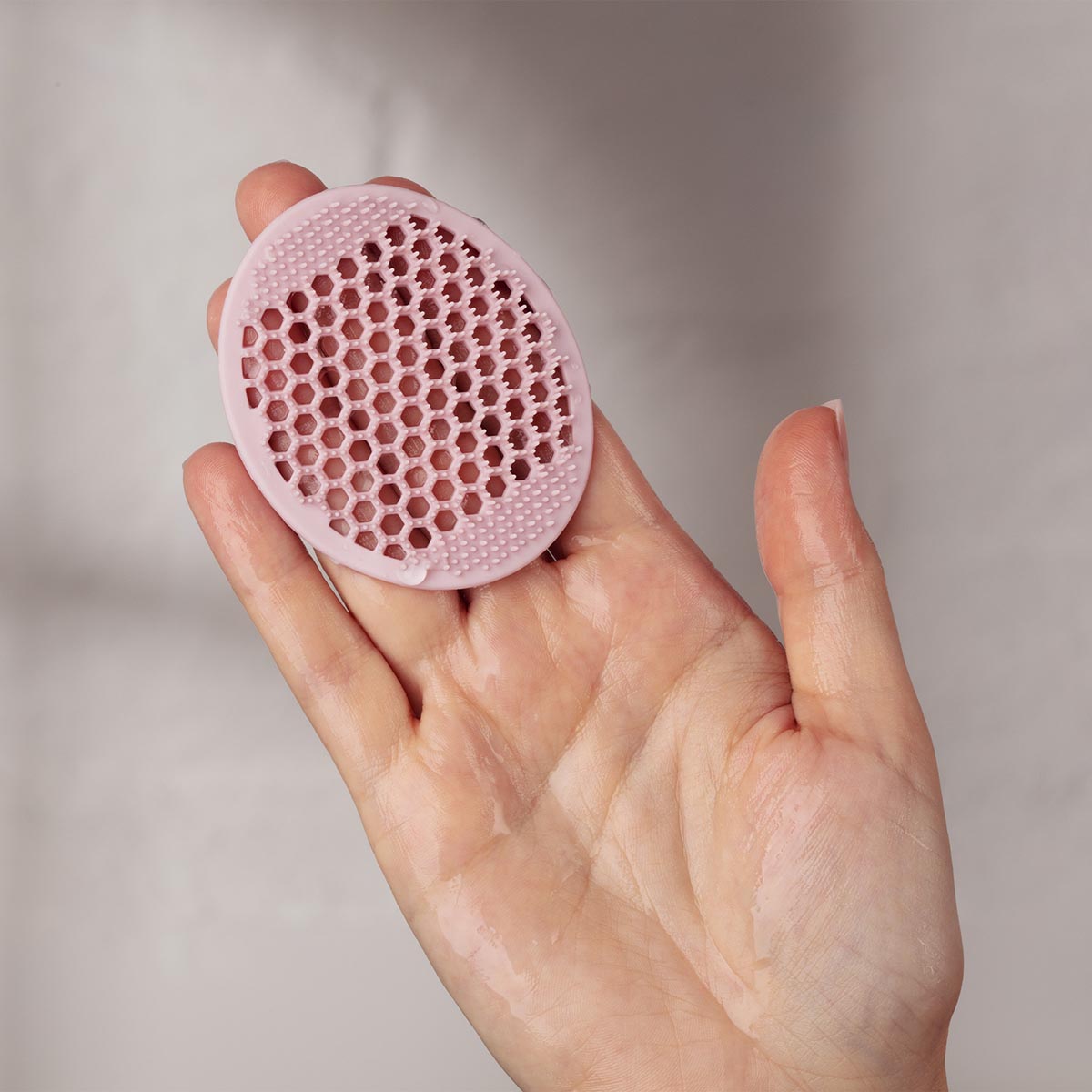 Odacité Pore & Face Cleansing Brush is a 3-in-1 silicone brush with flexible, antimicrobial bristles to target and sweep away pore-clogging dirt, pollutants, and long-wear makeup.