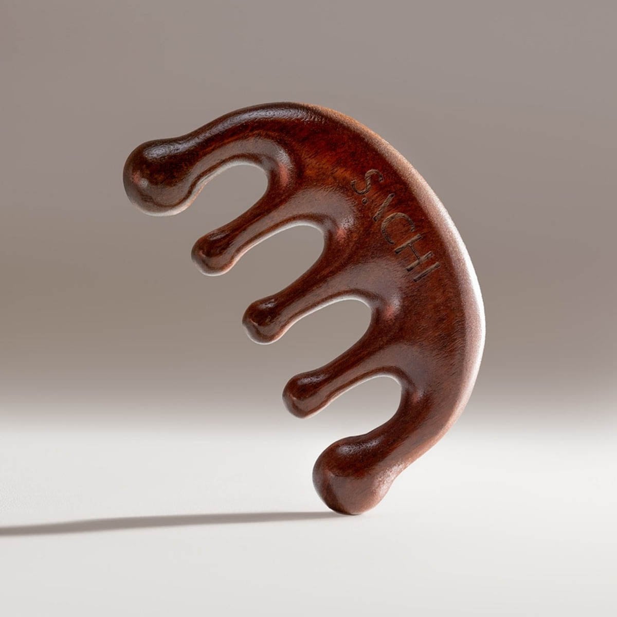 Sachi Skin Marma Facial Comb is made from sustainably sourced, polished sandalwood.